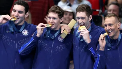 Why Do Olympic Swimmers Wear Winter Coats? Explained