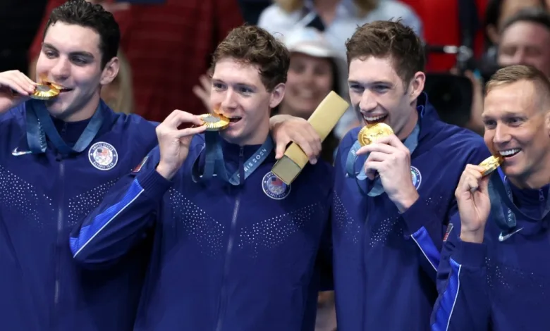 Why Do Olympic Swimmers Wear Winter Coats? Explained